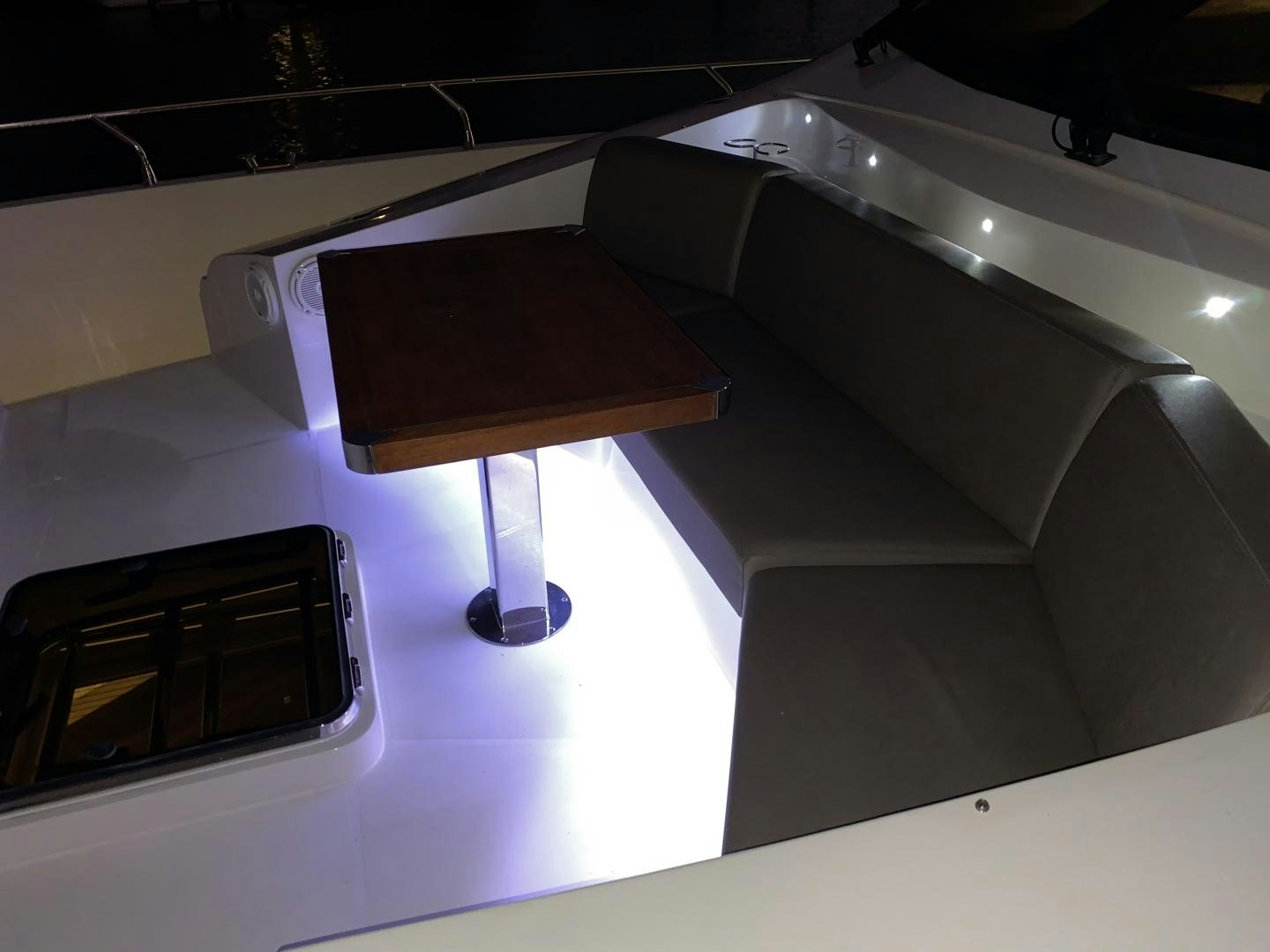 a table and chairs in a room aboard No Name Yacht for Sale