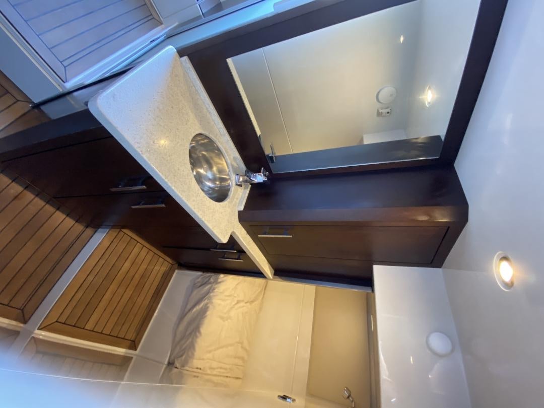 a silver and black object on a metal surface aboard No Name Yacht for Sale