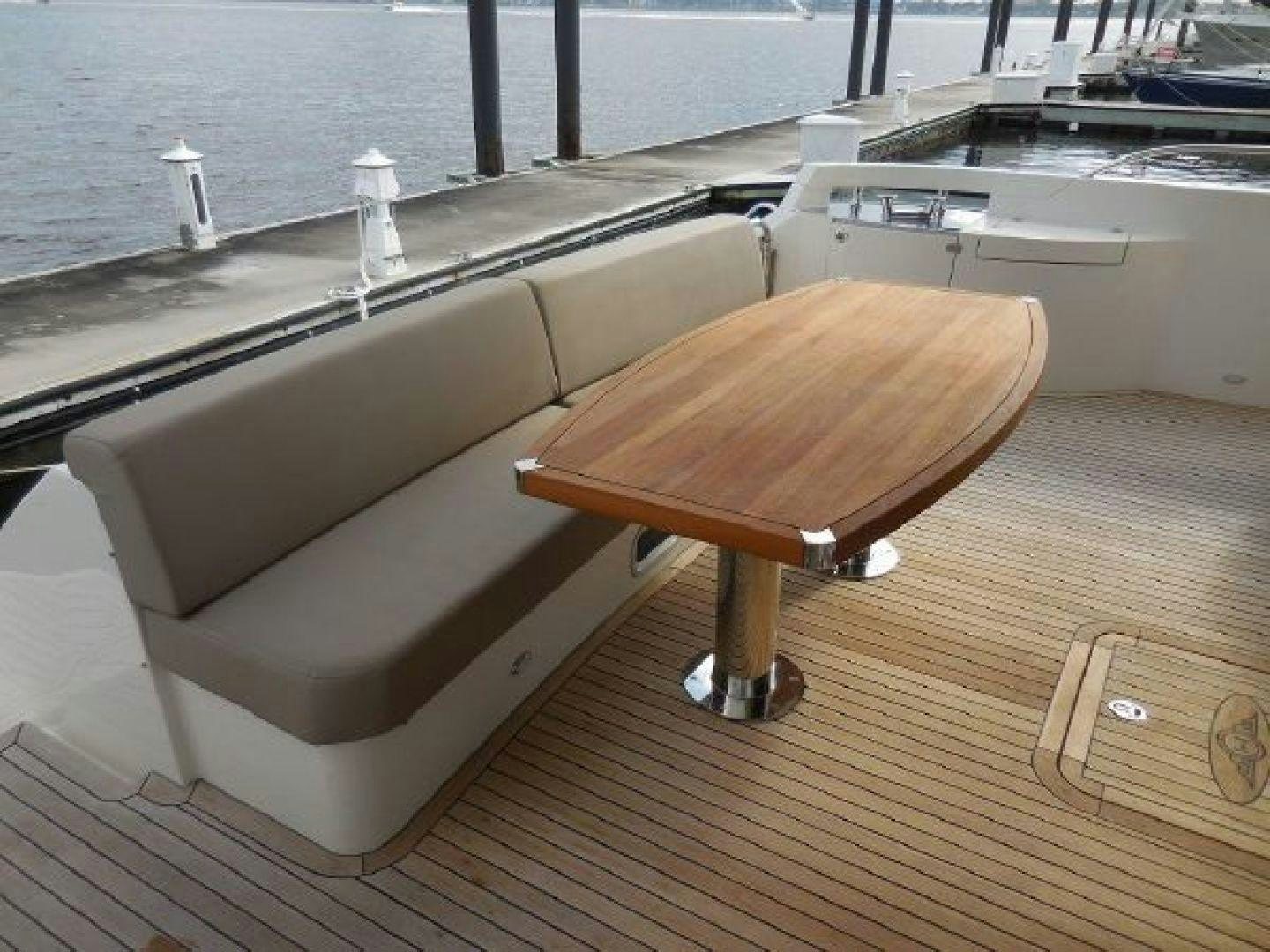a wooden bench next to a pool aboard No Name Yacht for Sale