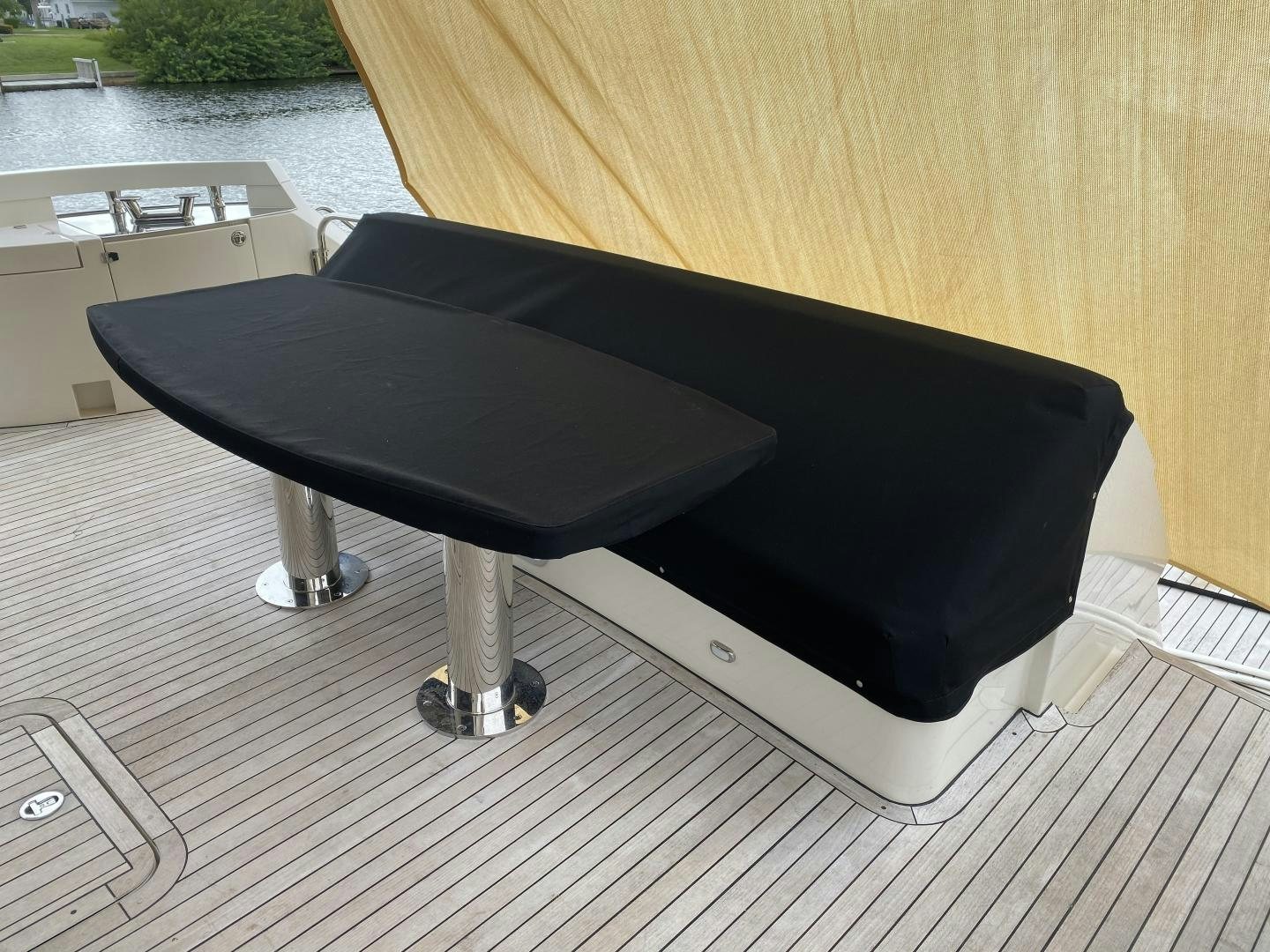 a black couch on a deck aboard No Name Yacht for Sale