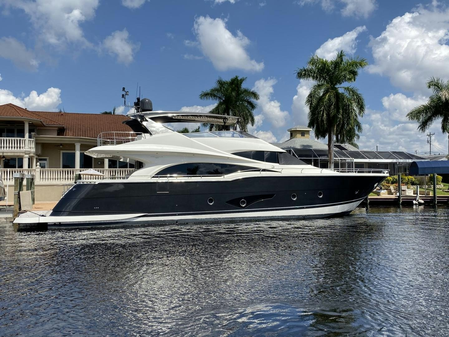 a yacht docked at a pier aboard No Name Yacht for Sale