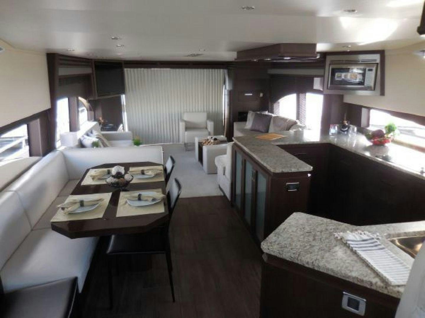 a large room with a table and chairs aboard No Name Yacht for Sale