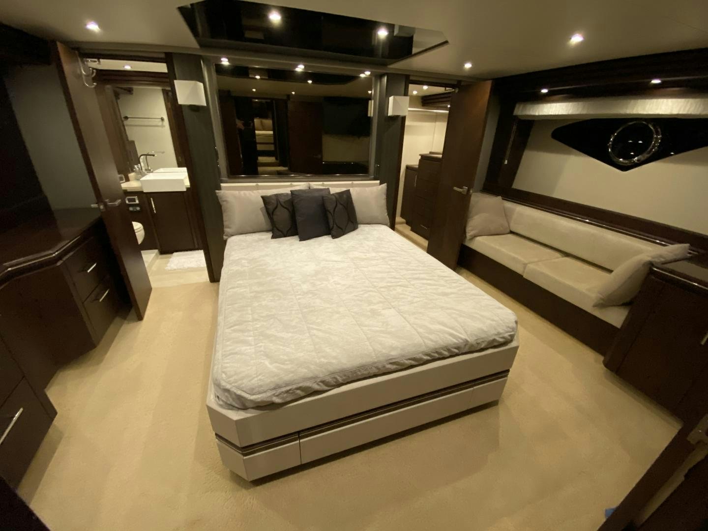 a room with a bed and a mirror aboard No Name Yacht for Sale