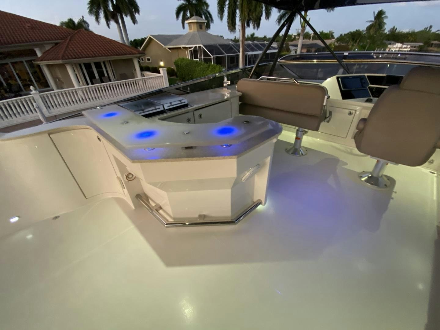 a white boat on a deck aboard No Name Yacht for Sale