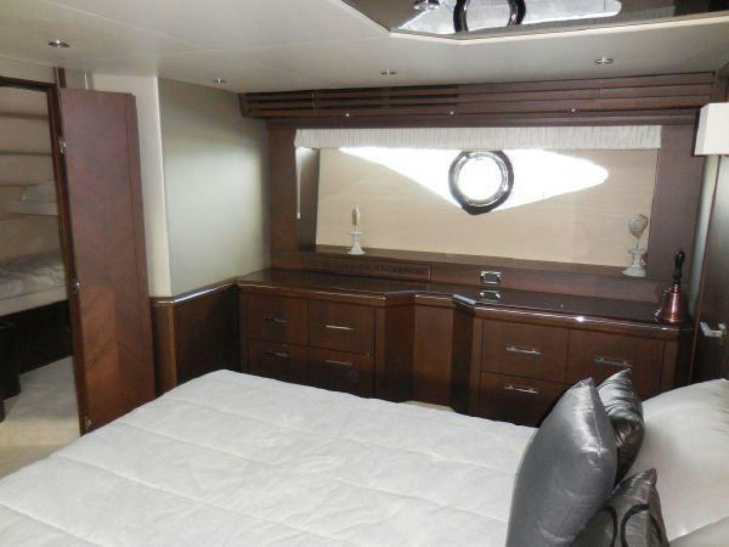 a bed with a white sheet aboard No Name Yacht for Sale