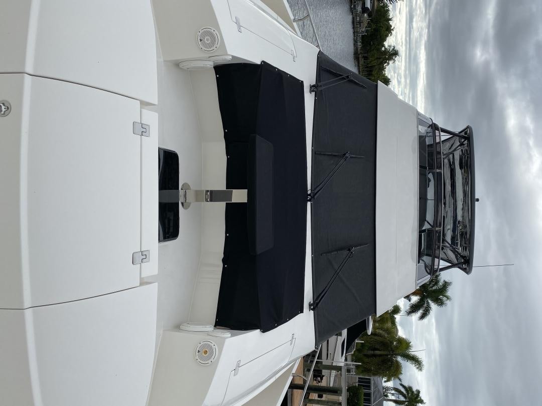 a white building with a black door aboard No Name Yacht for Sale