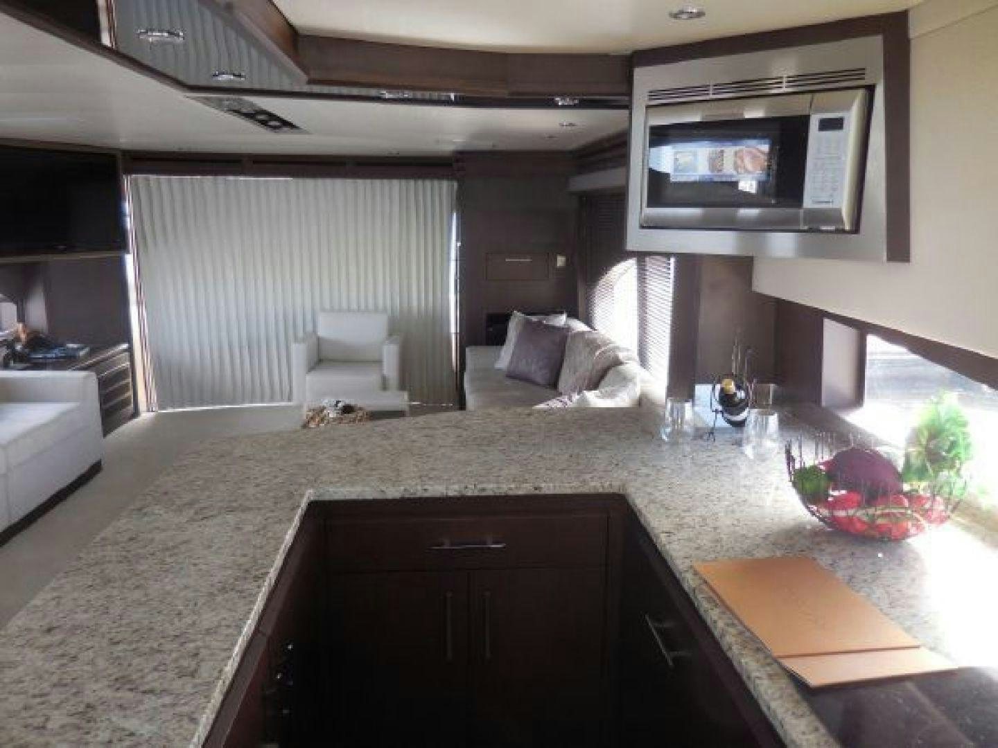 a living room with a large tv aboard No Name Yacht for Sale
