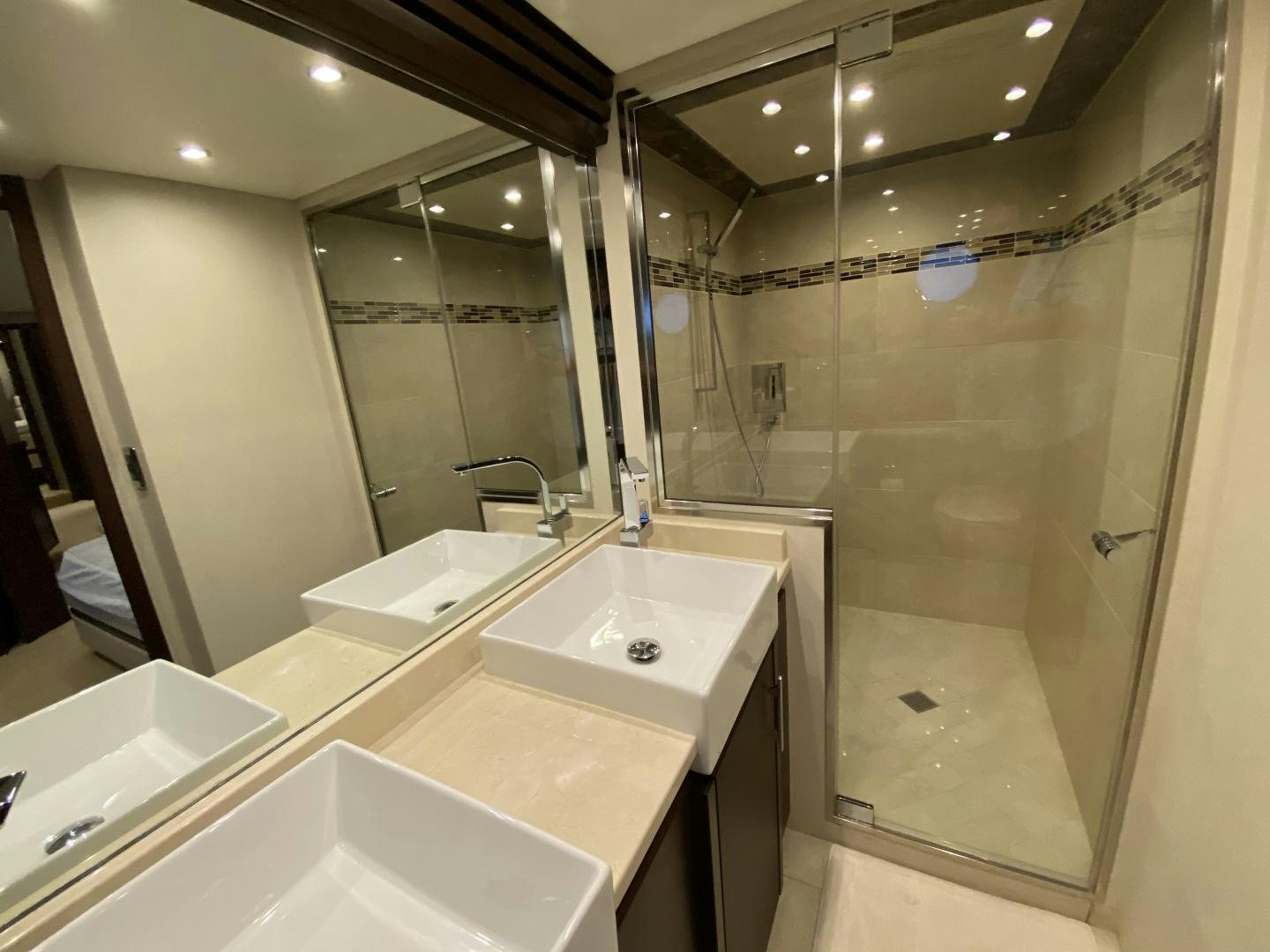 a bathroom with a large mirror aboard No Name Yacht for Sale