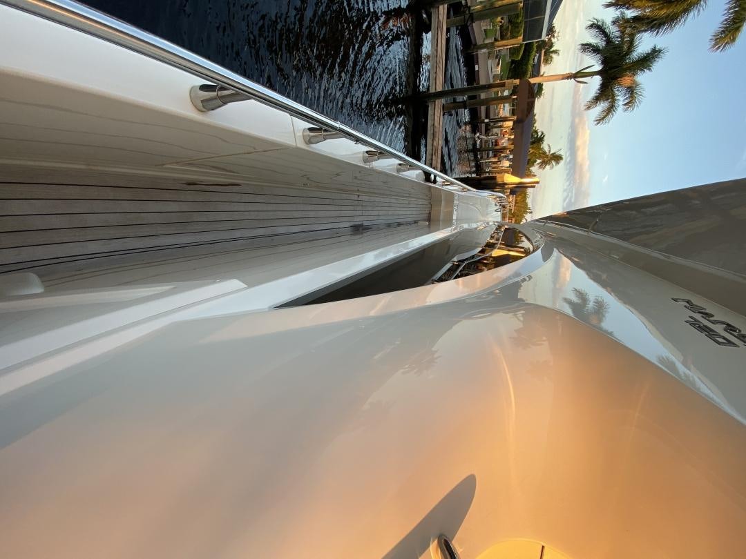 a white car with a large windshield aboard No Name Yacht for Sale