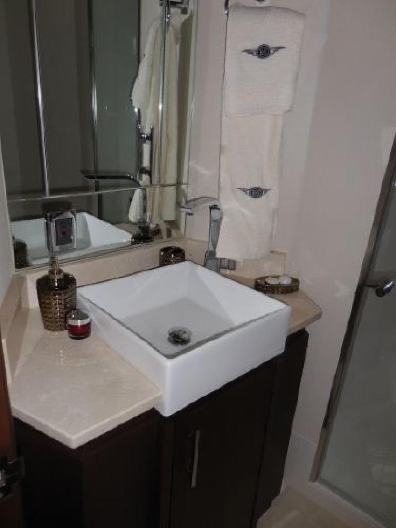 a bathroom with a sink and mirror aboard No Name Yacht for Sale