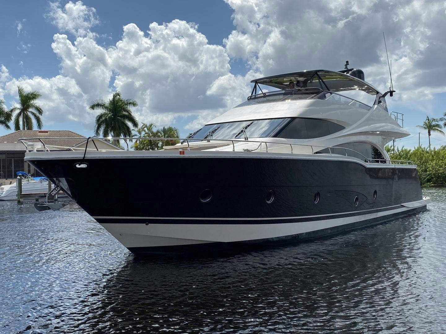 a white yacht on the water aboard No Name Yacht for Sale