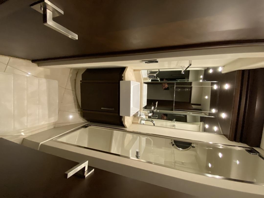 a kitchen with a microwave oven aboard No Name Yacht for Sale