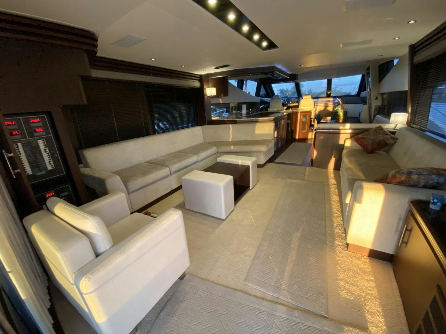 a living room with a couch and a television aboard No Name Yacht for Sale