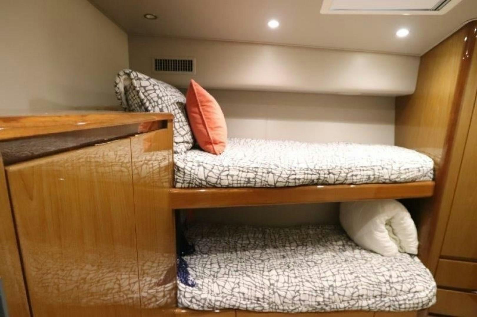 a bed with a pillow on it aboard No Name Yacht for Sale