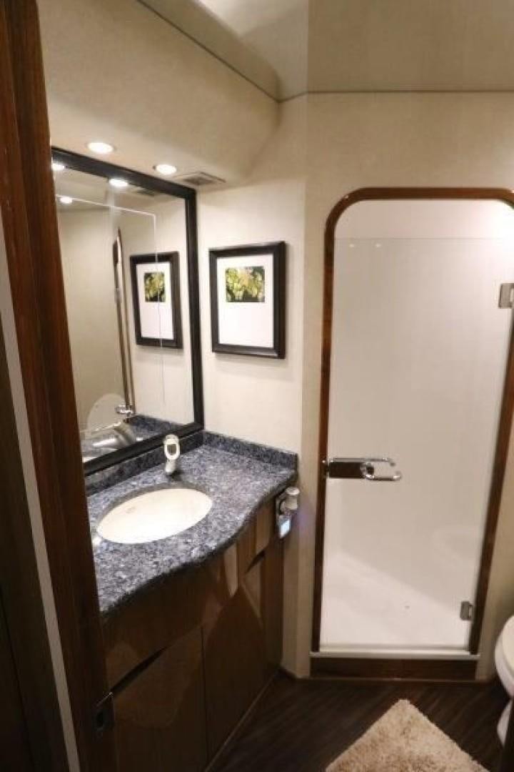 a bathroom with a sink and a mirror aboard No Name Yacht for Sale