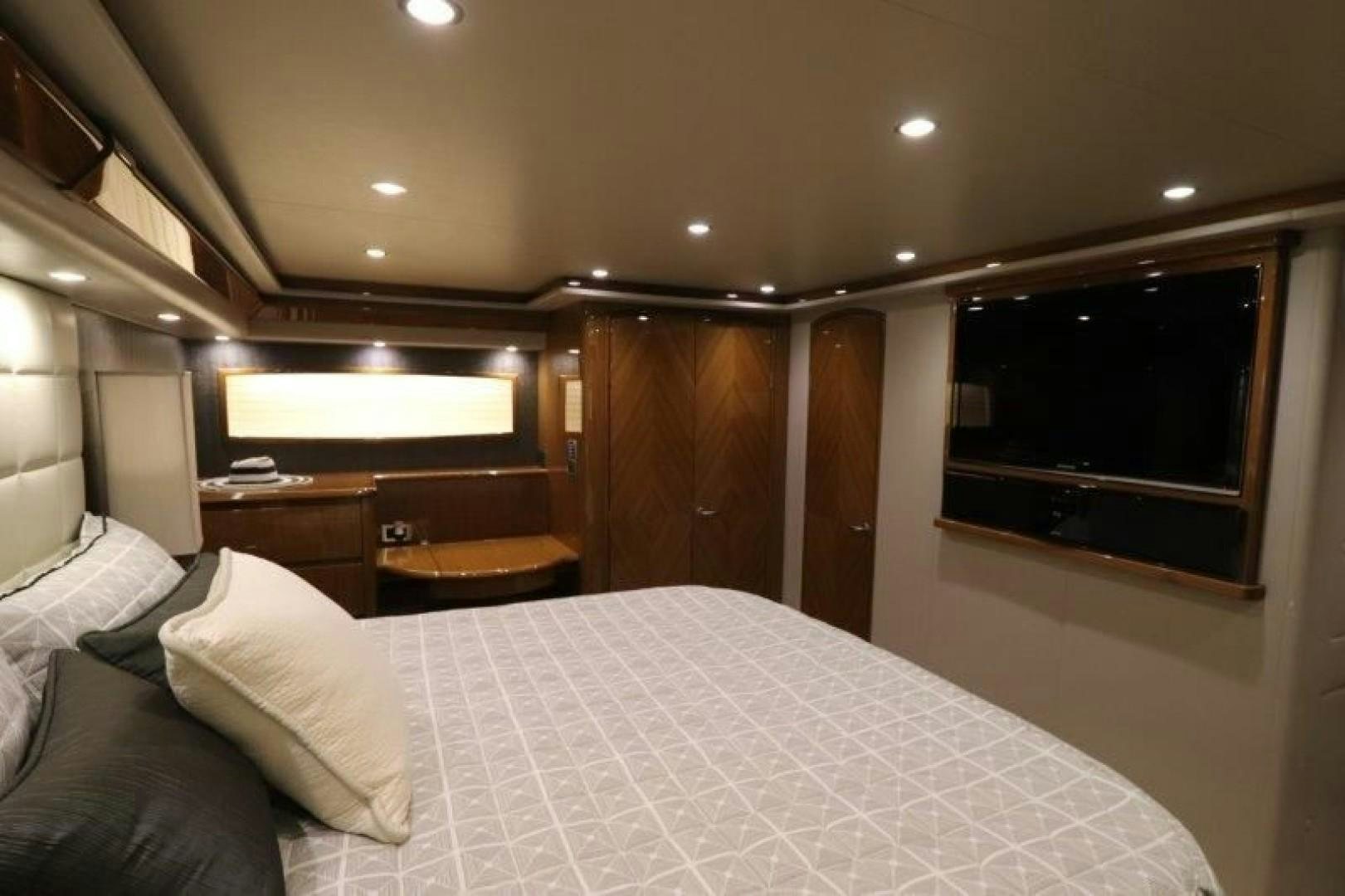 a bed with white sheets aboard No Name Yacht for Sale