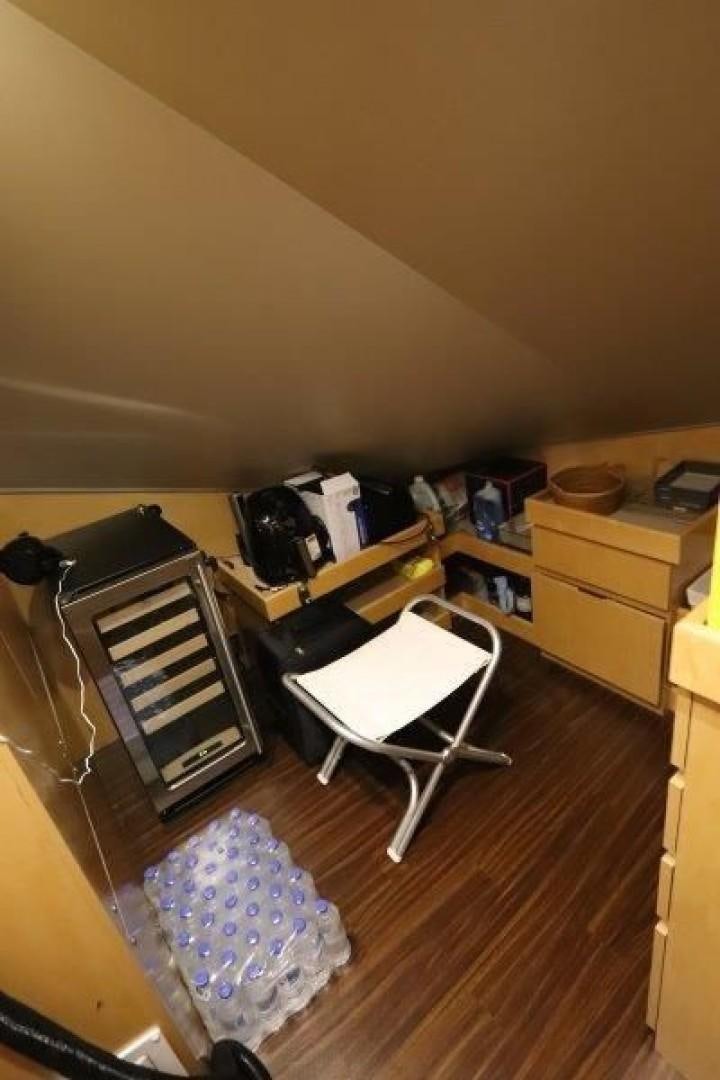 a kitchen with a garbage can and a bag on the floor aboard No Name Yacht for Sale