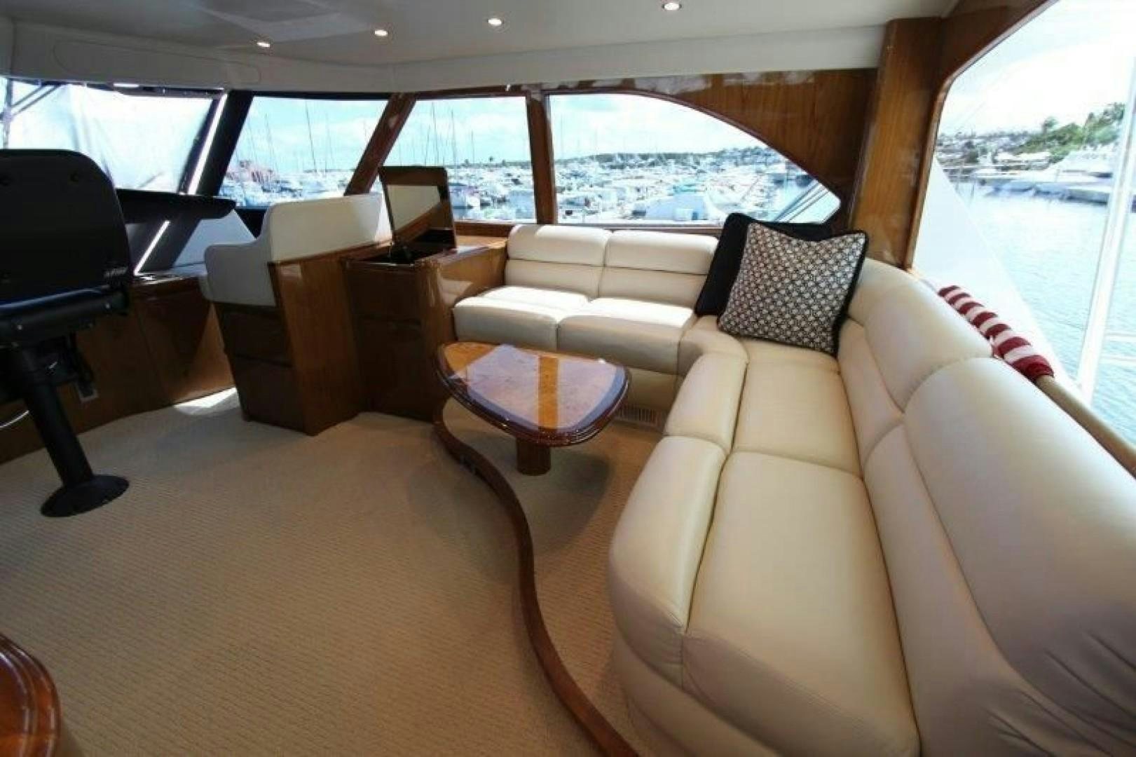 a living room with a couch and a table aboard No Name Yacht for Sale
