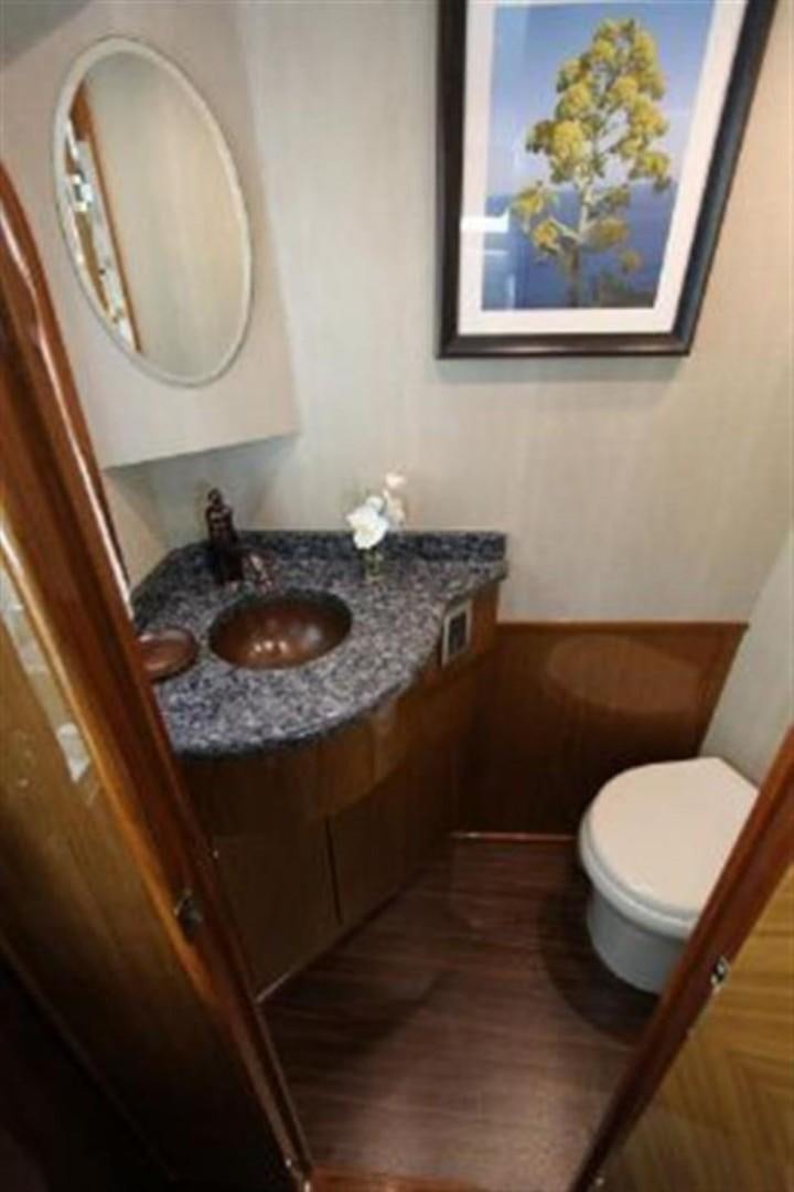 a bathroom with a sink and a mirror aboard No Name Yacht for Sale