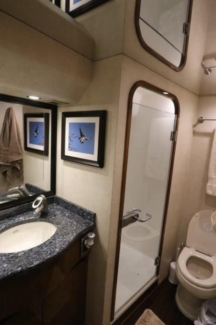 a bathroom with a toilet and a sink aboard No Name Yacht for Sale