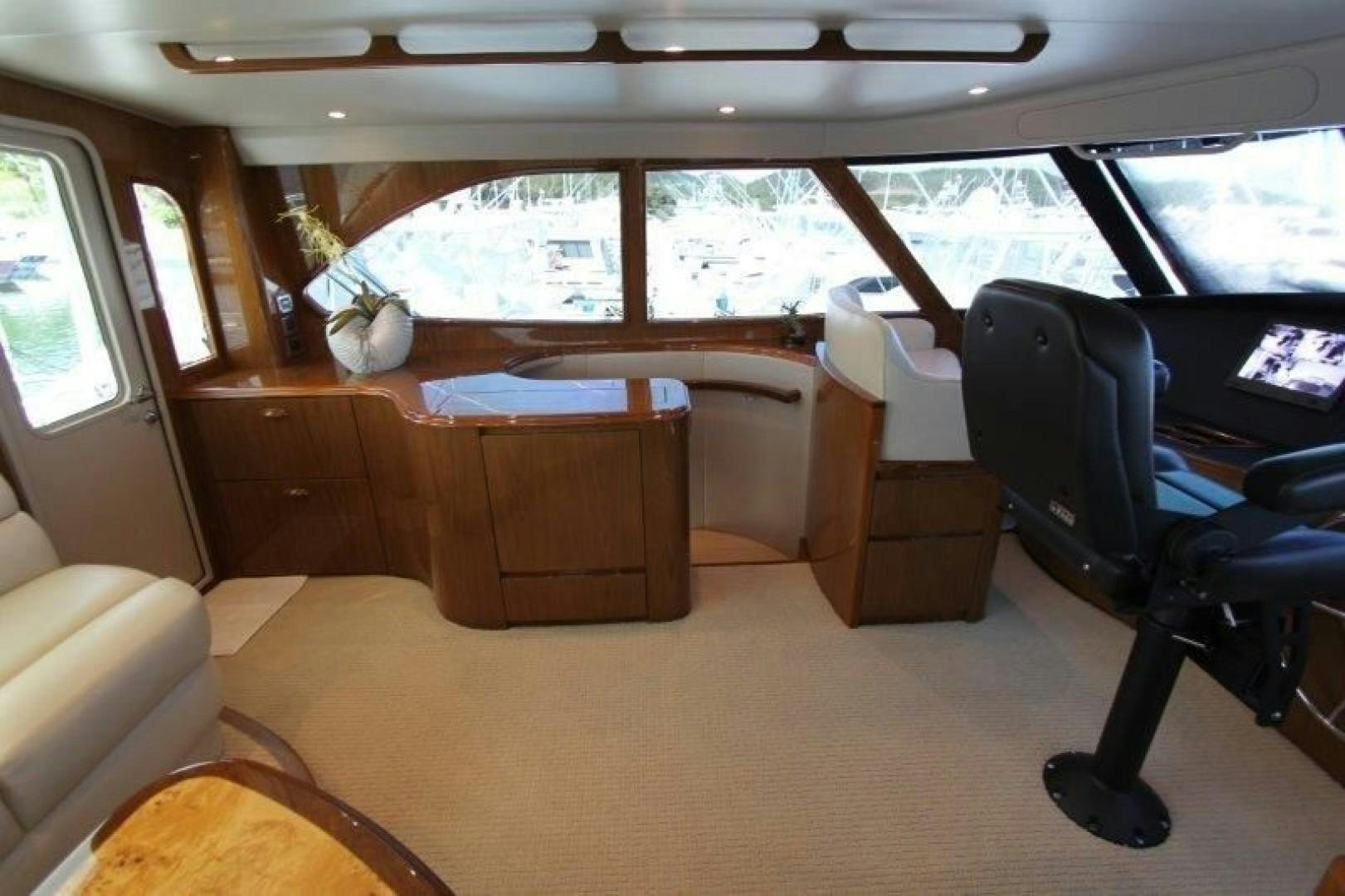 inside of a vehicle with desks and chairs aboard No Name Yacht for Sale