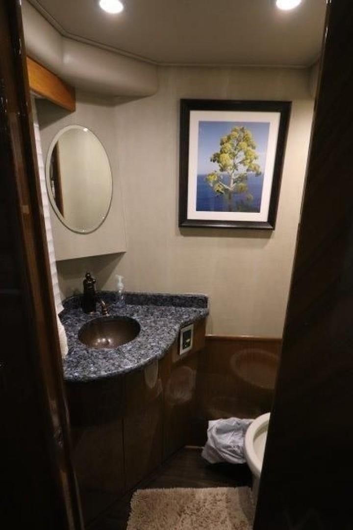 a bathroom with a sink and a mirror aboard No Name Yacht for Sale