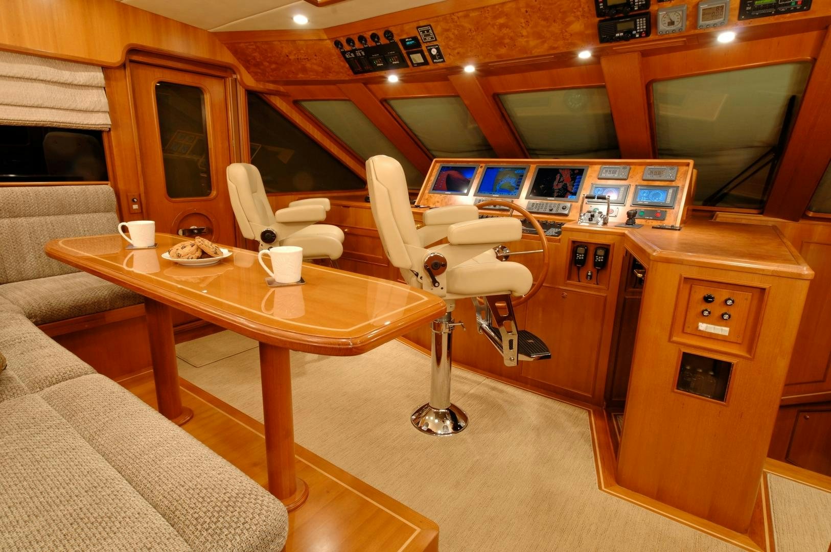 a room with a table and chairs aboard No Name Yacht for Sale