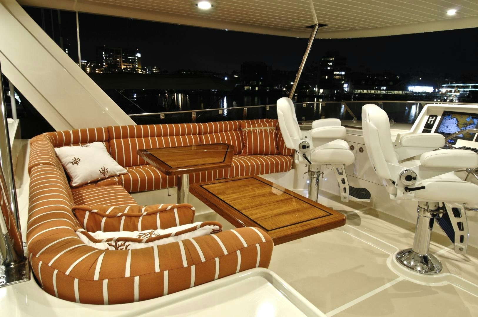 a room with couches and chairs aboard No Name Yacht for Sale