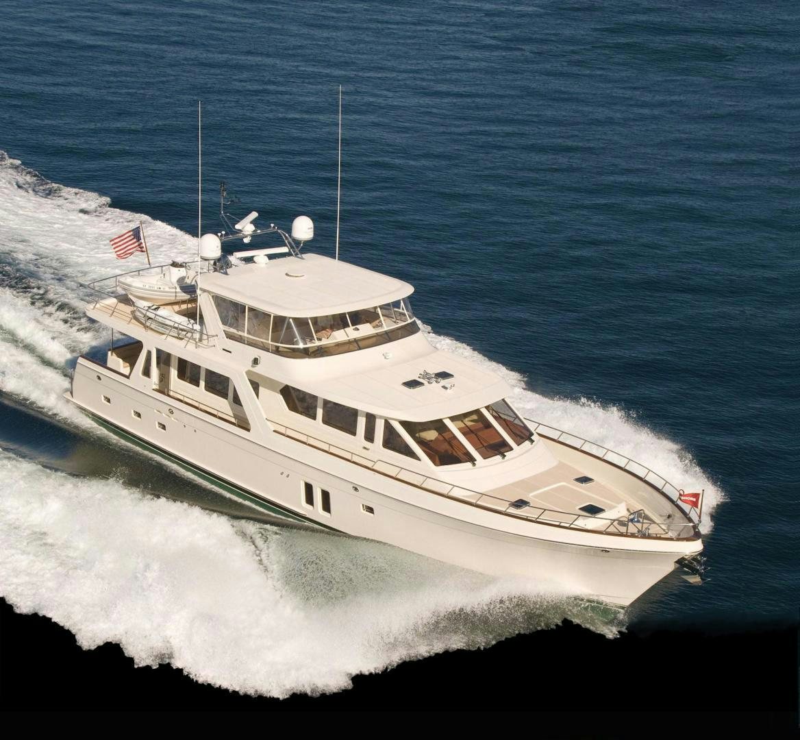 a white yacht on the water aboard No Name Yacht for Sale