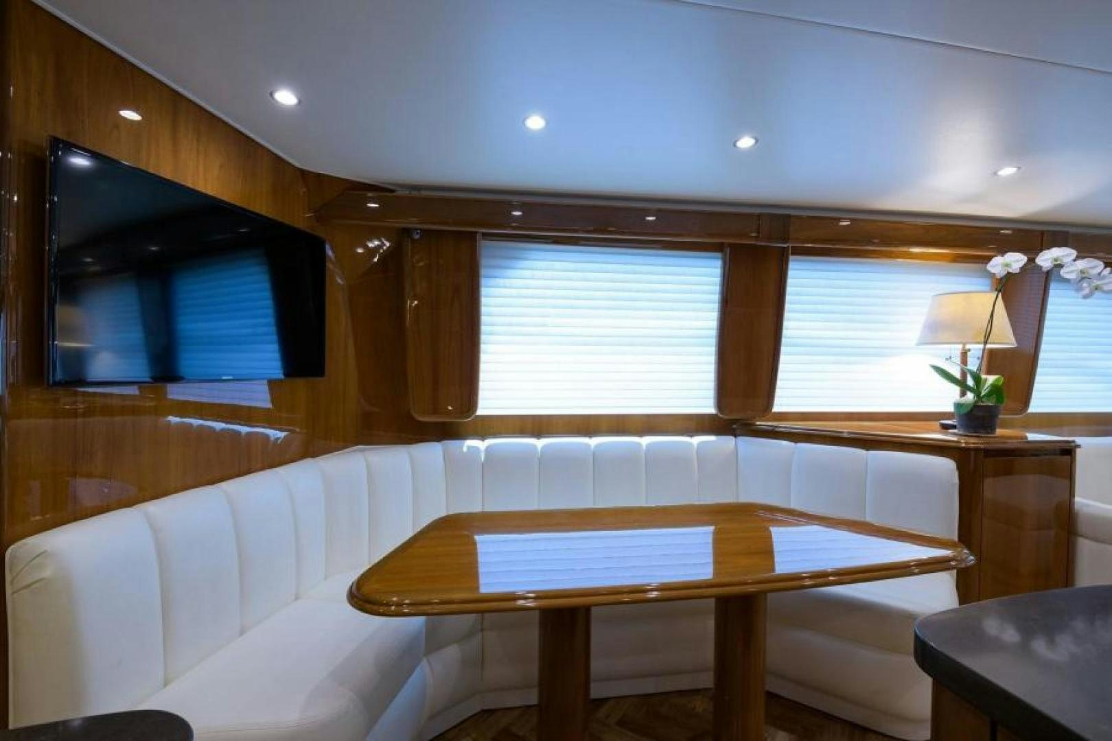 a room with a couch and a television aboard OSH IT Yacht for Sale
