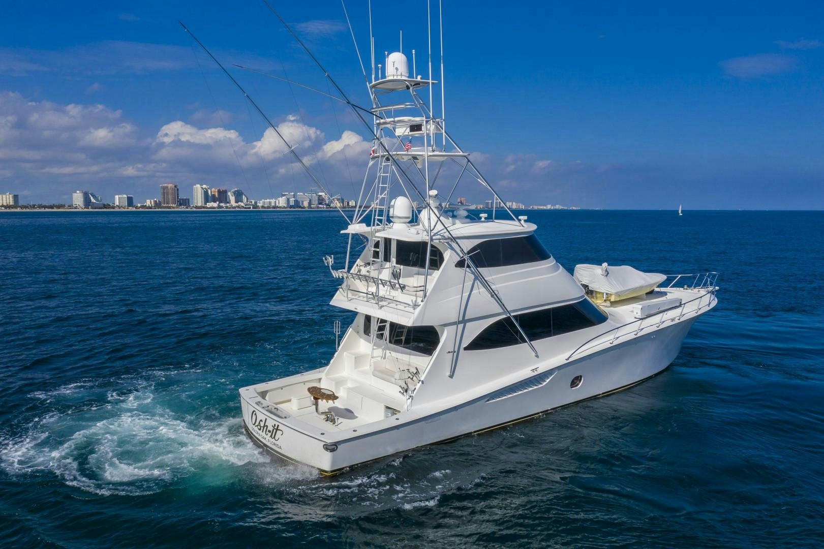 a white boat on the water aboard OSH IT Yacht for Sale