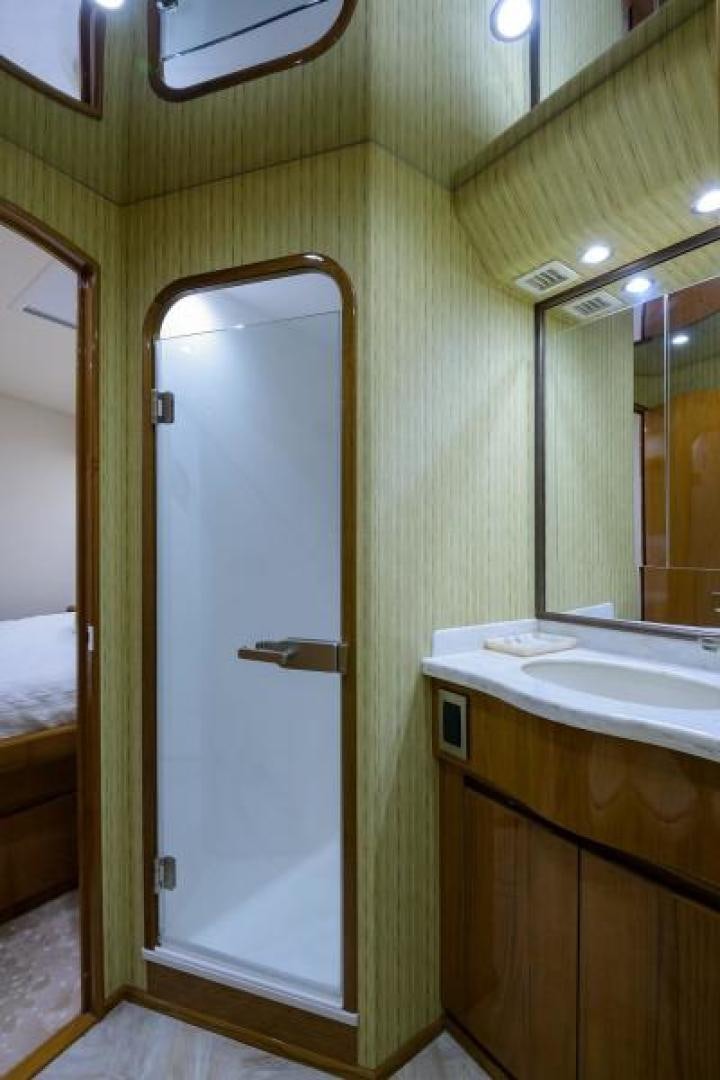 a bathroom with a sink and a mirror aboard OSH IT Yacht for Sale