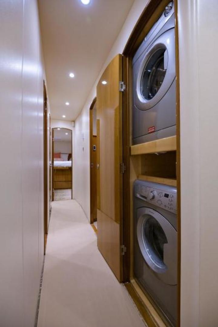 a row of washing machines aboard OSH IT Yacht for Sale