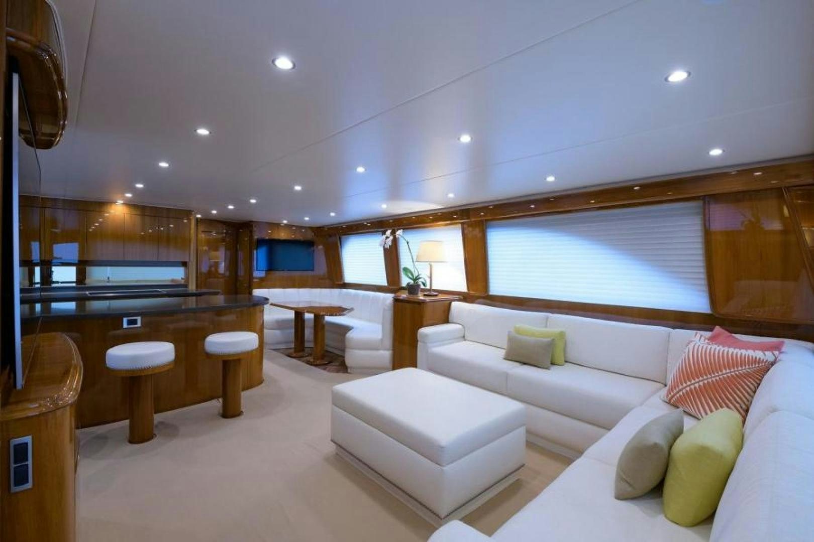 a room with a couch and a table and a window aboard OSH IT Yacht for Sale
