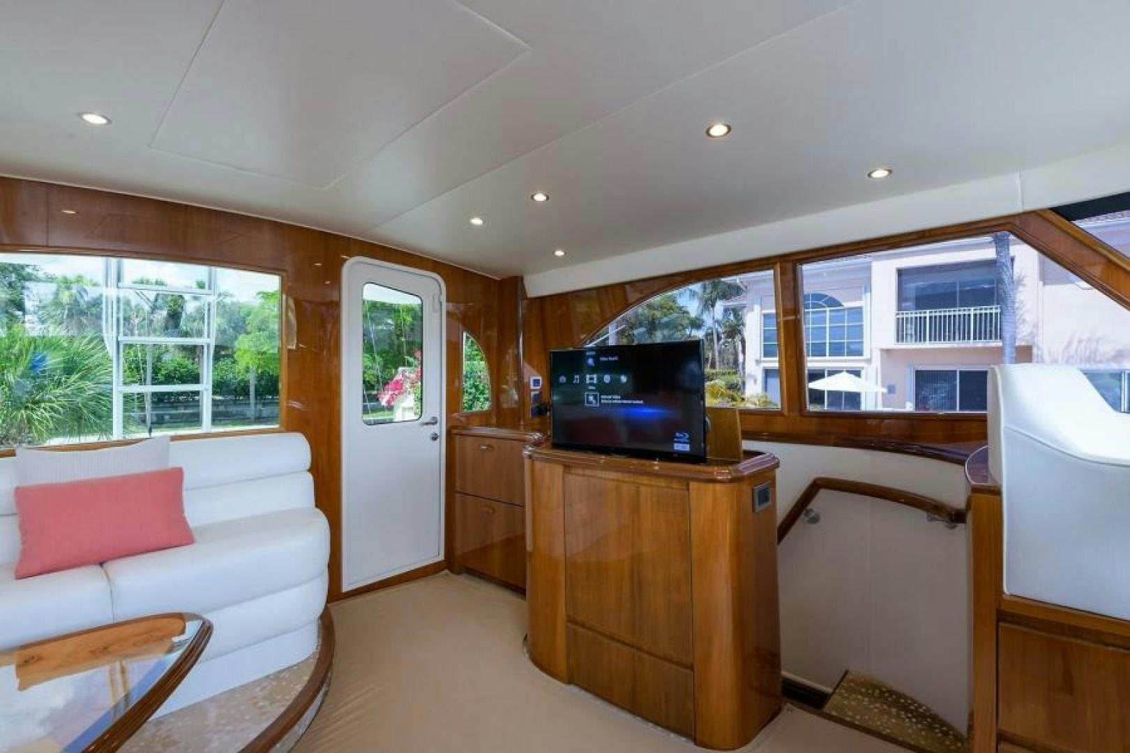 a living room with a tv and furniture aboard OSH IT Yacht for Sale