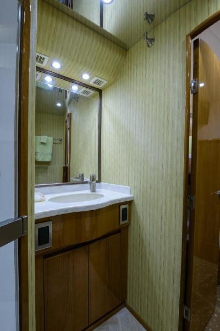 a bathroom with a sink and a mirror aboard OSH IT Yacht for Sale