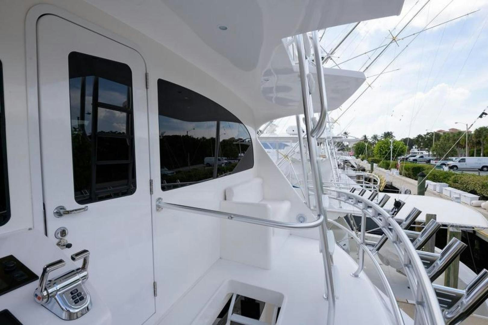 a white boat with windows aboard OSH IT Yacht for Sale