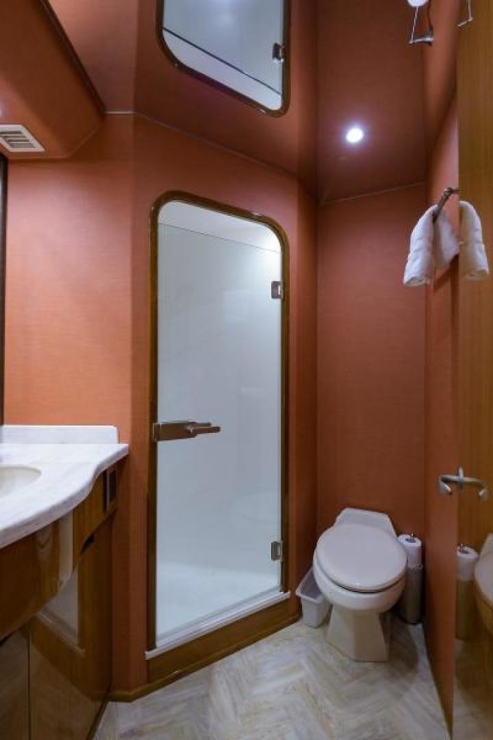 a bathroom with a toilet and sink aboard OSH IT Yacht for Sale