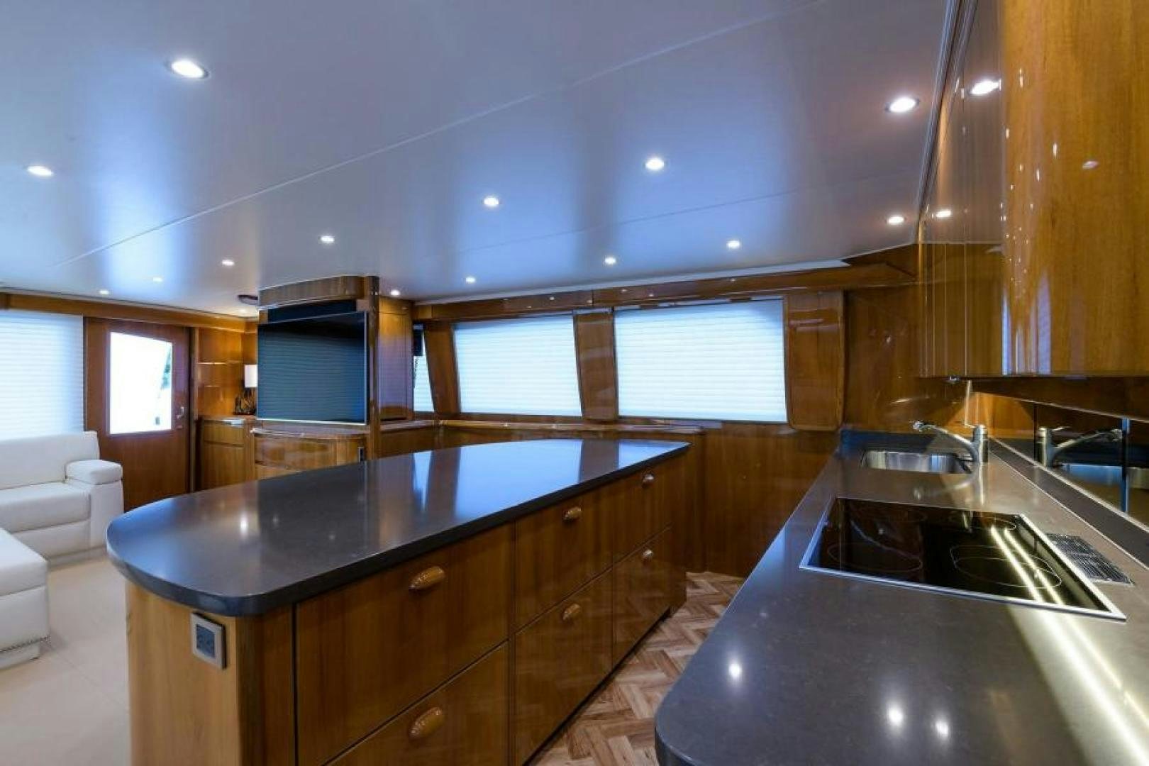 a kitchen with a black countertop aboard OSH IT Yacht for Sale