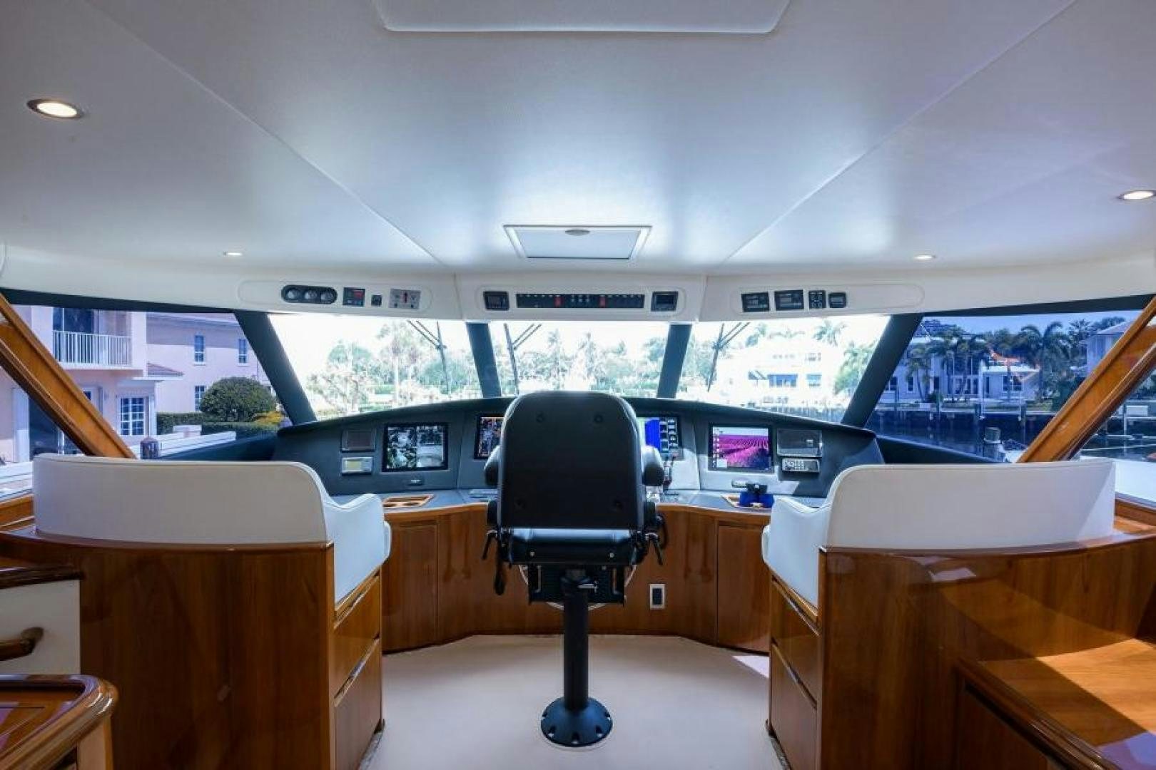 a room with tables and chairs aboard OSH IT Yacht for Sale