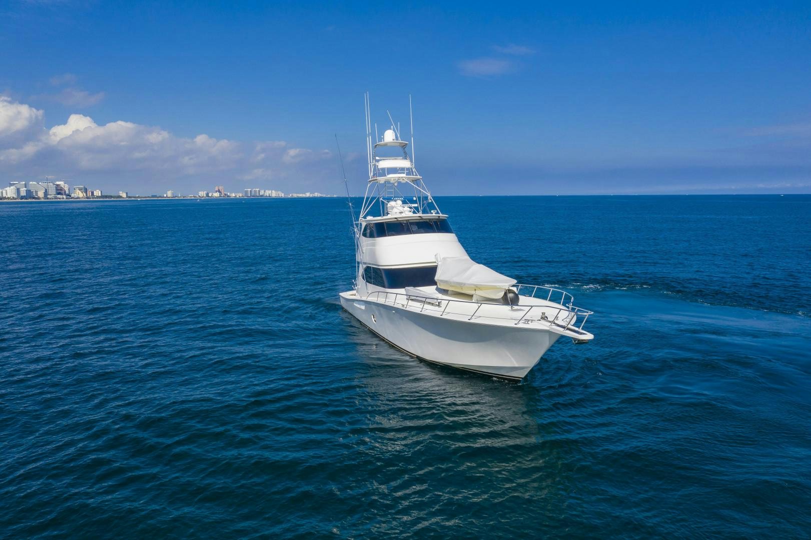 a white boat in the water aboard OSH IT Yacht for Sale