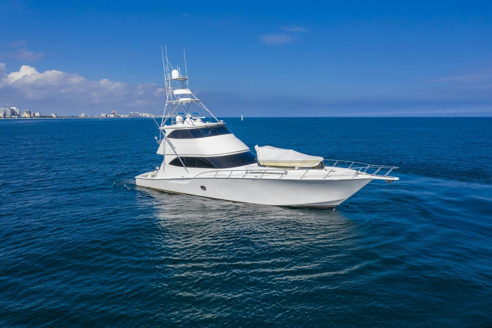 a white boat in the water aboard OSH IT Yacht for Sale