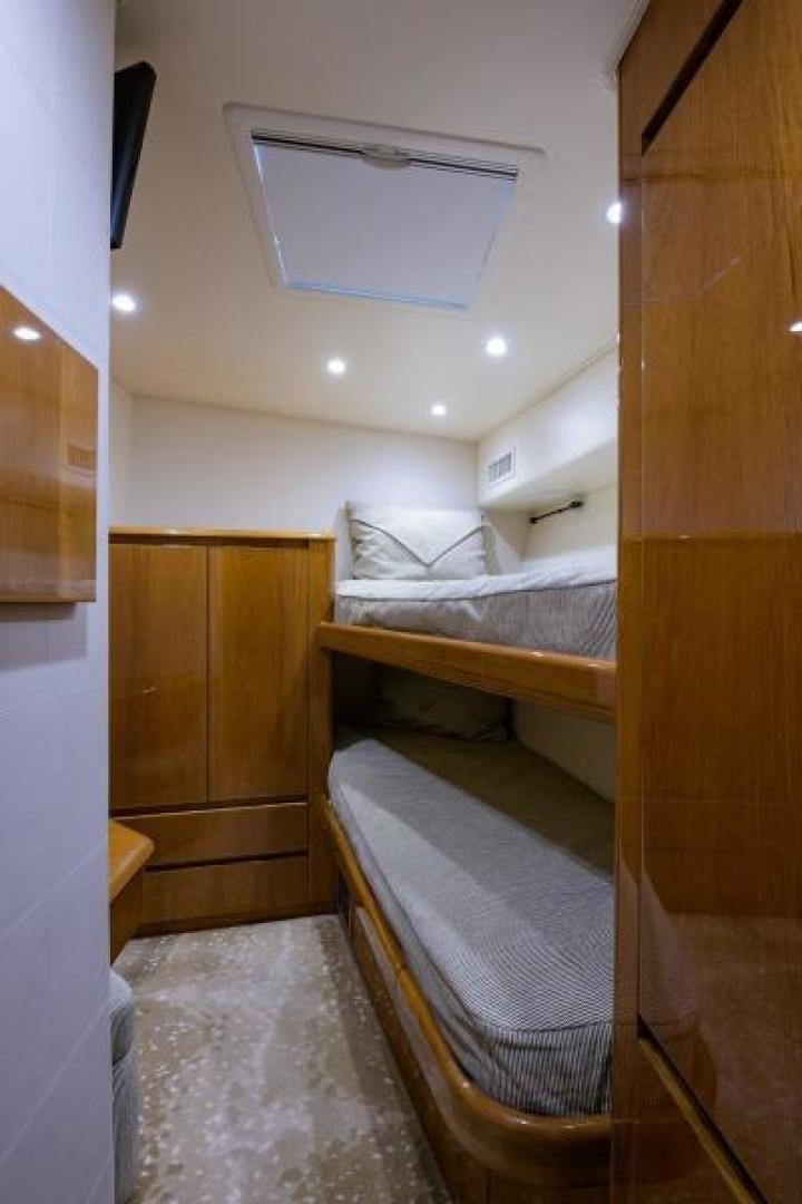 a room with bunk beds aboard OSH IT Yacht for Sale