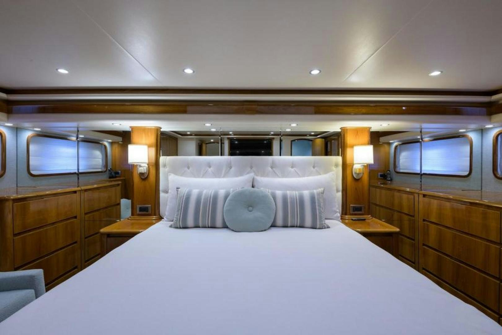 a bed with white sheets aboard OSH IT Yacht for Sale