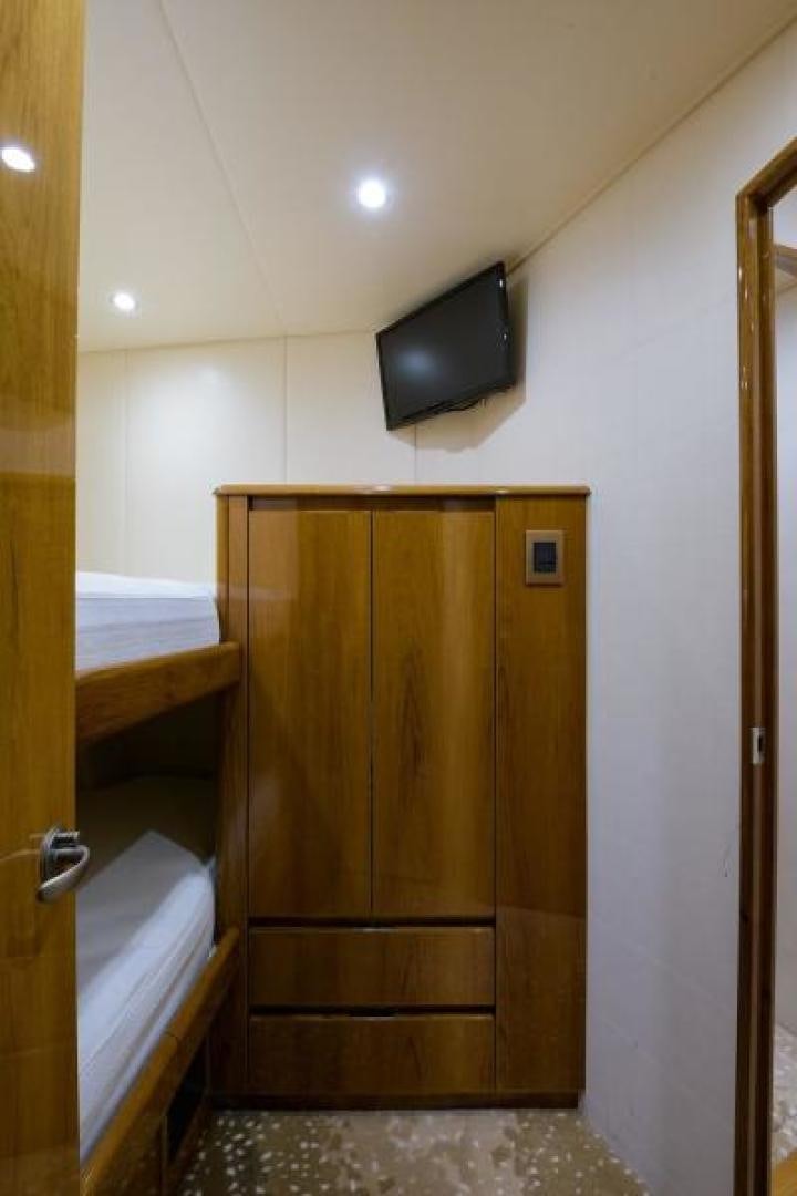 a wooden cabinet in a room aboard OSH IT Yacht for Sale