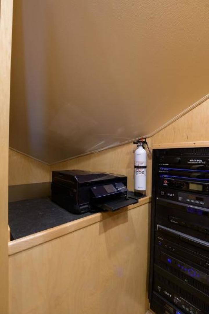 a bottle of liquor on a counter aboard OSH IT Yacht for Sale