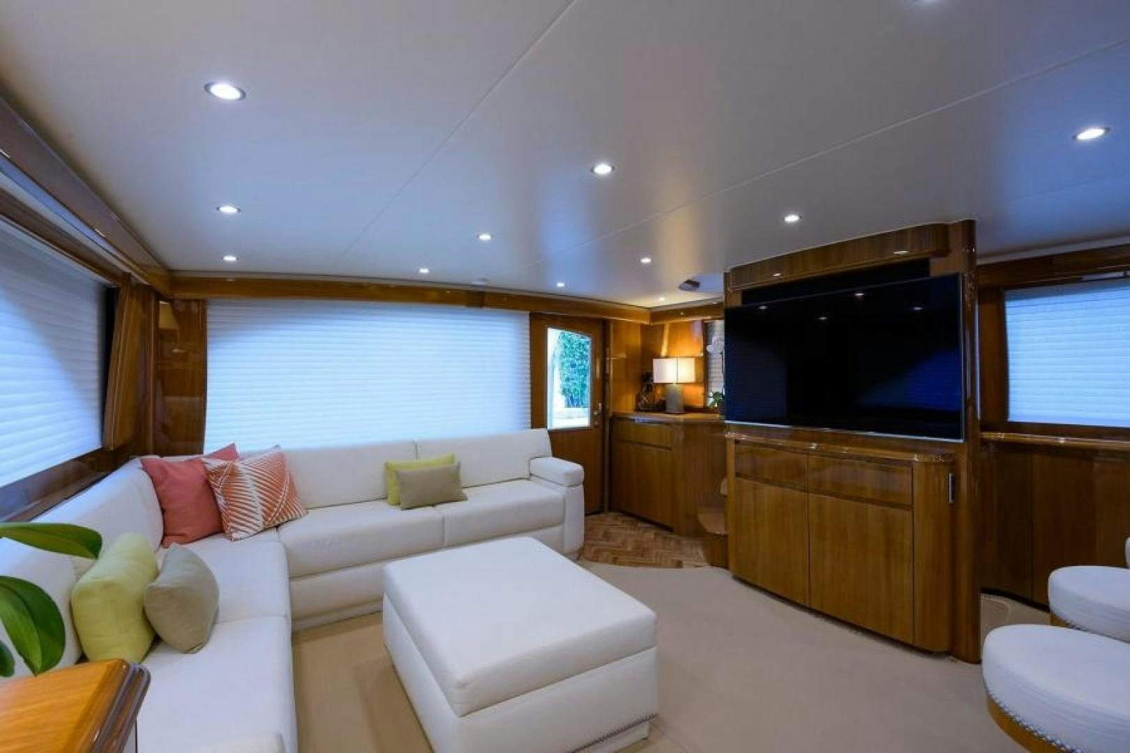 a living room with a large television aboard OSH IT Yacht for Sale