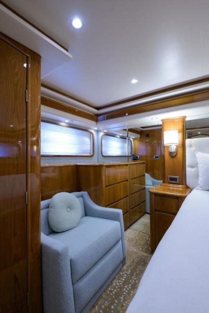 a bedroom with a bed and a desk aboard OSH IT Yacht for Sale