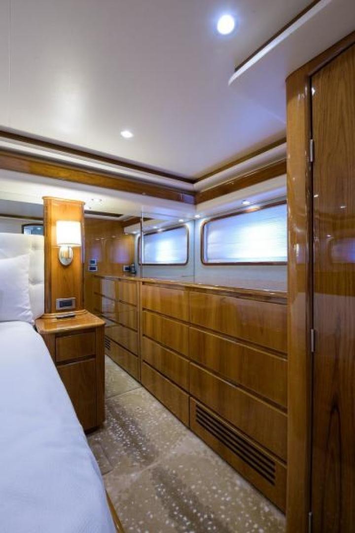 a bedroom with a bed and a desk aboard OSH IT Yacht for Sale