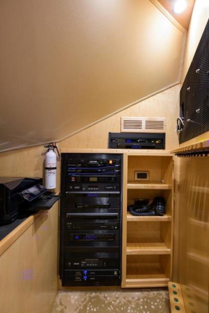 a shelf with a computer on it aboard OSH IT Yacht for Sale